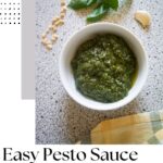 Pinterest image with the photo of pesto and a caption reading "Easy pesto sauce. Learn how to make it at lemonsandspices.com"